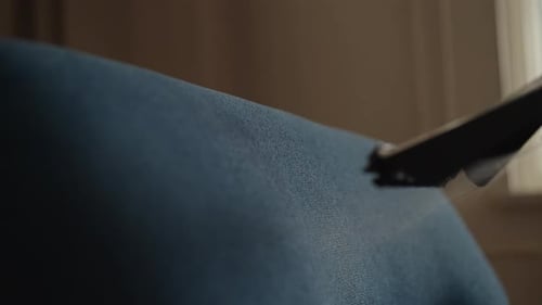 Vacuum Nozzle Sprays Upholstery With Cleaning Fluid