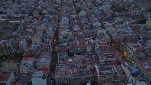 High Angle View of Blocks of Apartment Buildings in Urban Borough at Dusk Fly Above Dense Town Area