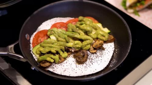 Vegan Food Cooking in Frying Pan With Vegetables