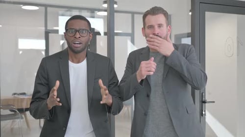 Portrait of Teammates Reacting to Failure in Office