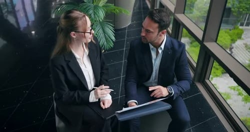 Business Colleagues Reviewing Data in Modern Office