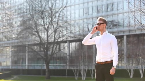 Business man in the city talking on the phone