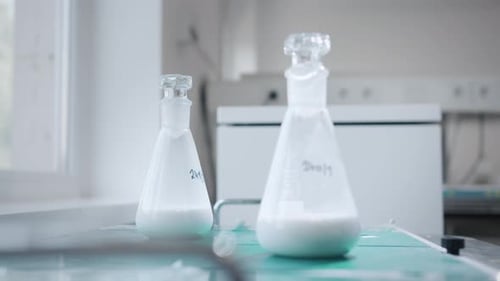 Beakers with Powder Placed on Lab Surface