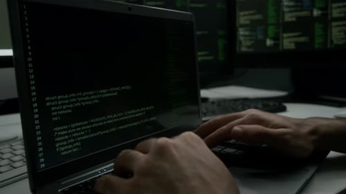 Close-up of Unrecognizable Programmer Writing Code on Laptop