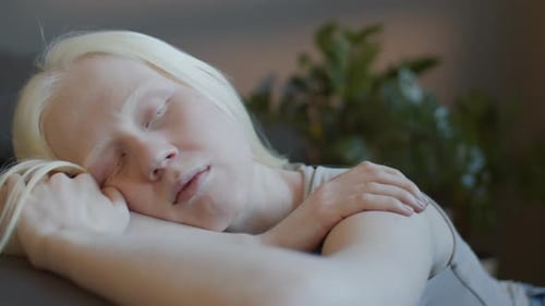 Young Adult Resting Indoors, Close Up