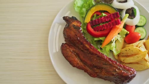 grill barbecue pork spare ribs with vegetables