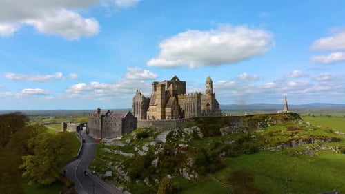 Aerial view of the Rock of Cashel, capturing ancient stone walls, round towers, and cathedral ruins