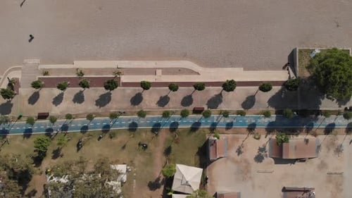 The Camera Flies Along the Beach Over a Wellequipped Blue Jogging Track