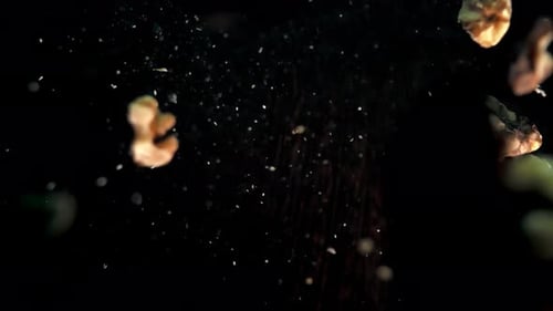 Shelled Walnuts Falling in Slow Motion