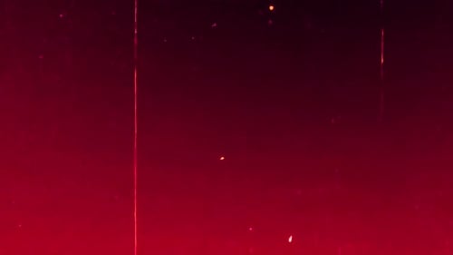 Dynamic dark red abstract background with subtle light particles creating a modern, energetic feel