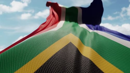 Waving South Africa National Flag Against Cloudy Sky