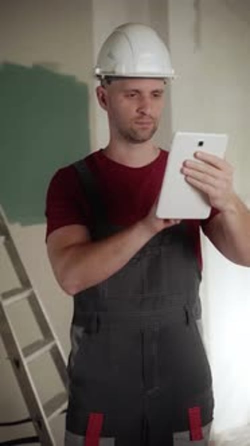 Construction Worker Painting Interior Wall