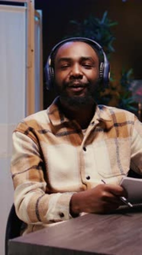 Young Adult Recording a Podcast at the Studio