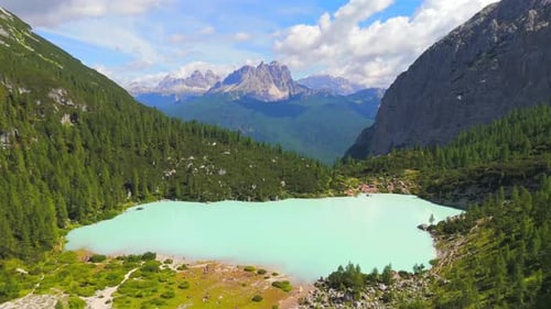 Lake Sorapis, nestled in the Dolomites of Italy, is renowned for its stunning turquoise waters, surr