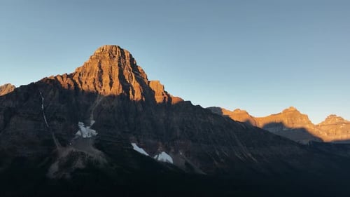 Mountains and rocks during sunset. High rocky mountains. Banff National Park, Alberta, Canada.