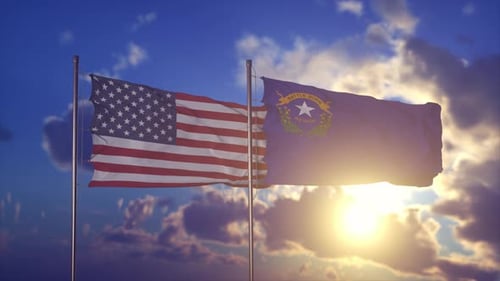 US and Nevada State Flags Waving with Sun in Blue Sky