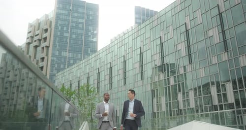 Business Men Meeting Outdoors Walking on Street Talking