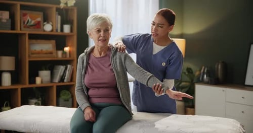 Stretching arm, physiotherapist and senior woman with recovery in clinic for physiotherapy