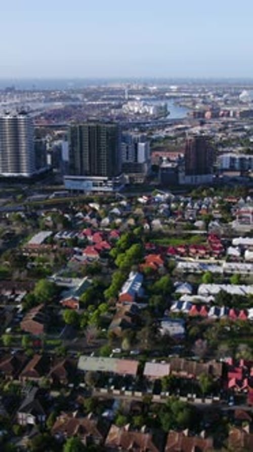 Vertical drone shot overlooking the cityscape of Adelaide, sunny day in Australia