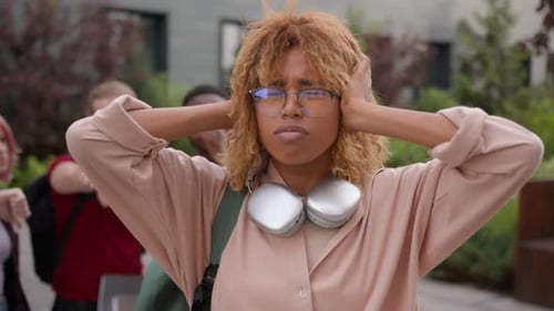 Stressed African American School Girl Student Bullied Woman Close Ears with Hands Silence Don't Hear