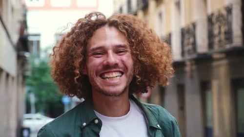 Smiling Man Laughing in City Street