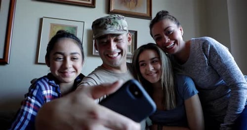 Happy Family Smiling Together Taking Selfie Indoors