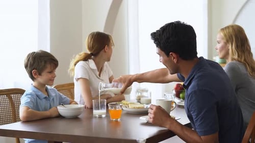 Family Enjoying Breakfast Together at Home