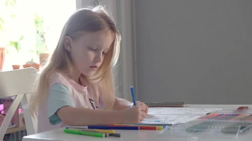 Blonde Kid Girl School Pupil Studying Online From Home Watching Web Art Class Lesson or Listening