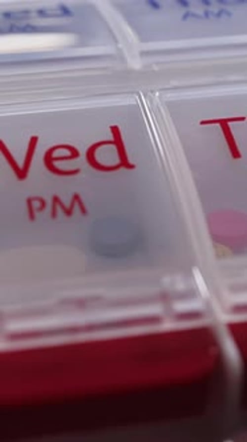 Brown Medication Pills and Plastic Pill Organizer