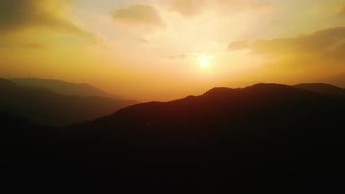Golden Sunset Over Mountainous Landscape