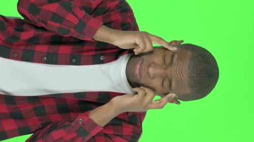 Vertical Video of African Man Having Headache on Green Background