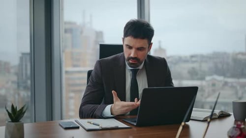 Nervous Boss Talking Video Meeting Sitting Office Closeup Manager Videocalling