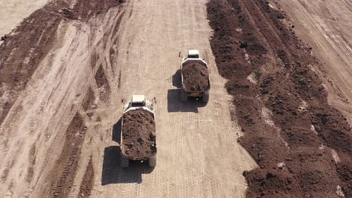 Articulated hauler Truck loaded with Soil at an industrial development site.