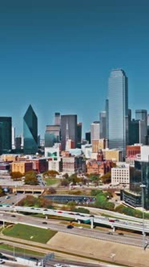 Aerial view of Dallas skyline showcasing urban architecture and highways