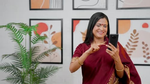 Woman Using Smartphone at Home