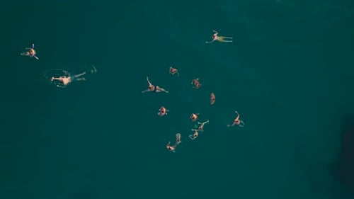 Aerial View Ocean at Dusk Swimmers Enjoy the Last Light