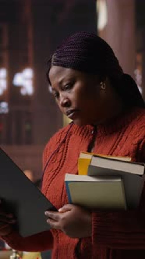 Vertical Video Female Educator Preparing Her Teaching Materials and Resources in the Library