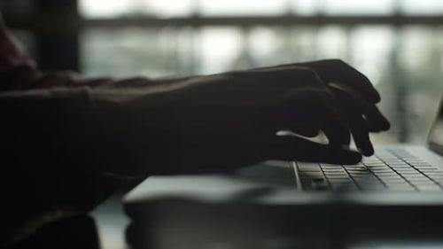 Closeup Tracking Shot of Unrecognizable Male Student Working Studying on Keyboard Laptop Computer