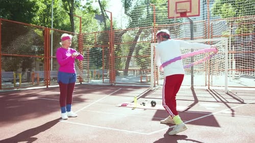 Two Friends Happily Enjoy Various Outdoor Fitness Activities Together in the Fresh Air
