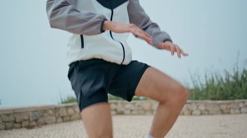 Closeup Athlete Legs Training in City Park Professional Sportsman Body Training