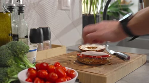 Bagel Sandwich Preparation on Cutting Board