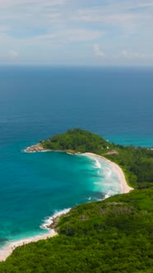 Tropical Coastline with Waves Meeting Lush Greenery Seychelles Mahe