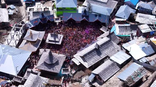 Aerial drone shot displaying the mesmerizing top-down view of Holi celebrations in Sangla Mandir