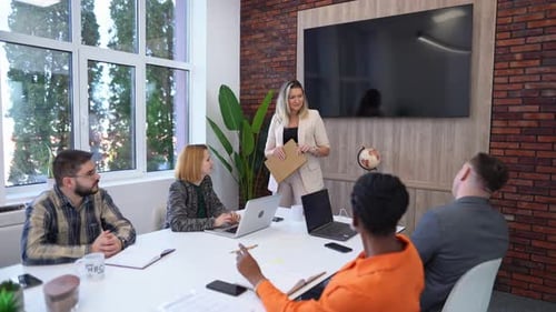 Team meeting in a modern office discussing project updates and strategies
