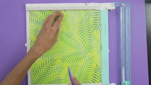 Making fold marks on patterned paper with score board tool