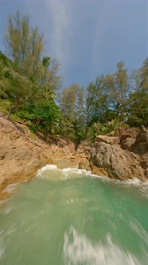 Woman Comes Out of the Water on Isolated Tropical Beach