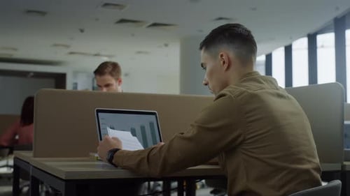 Colleagues Working in an Open Plan Modern Office