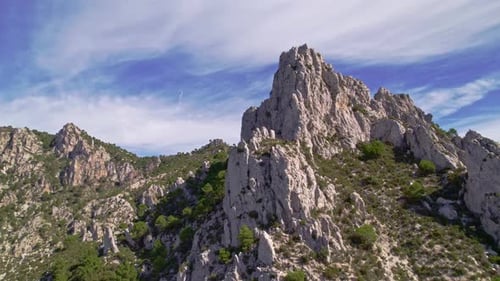 Panoramic flight over high mountain landscape. Big crags and steep mountain cliffs. Granada. Spain.