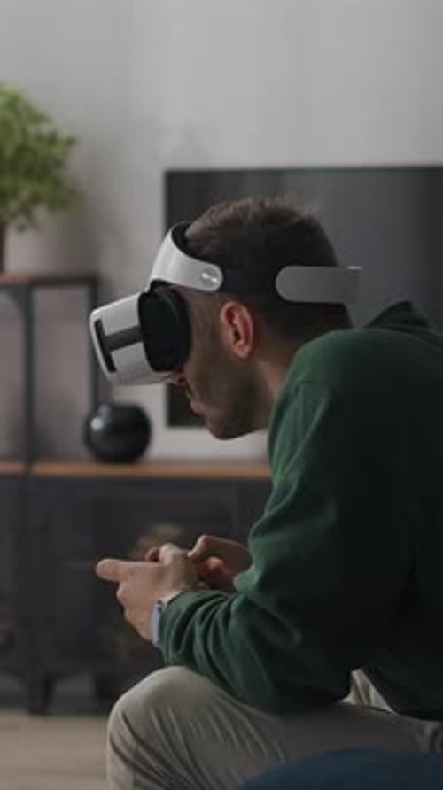 Man Wearing VR Headset Interacting with Virtual Reality