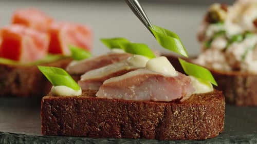 Preparing Herring Gourmet Appetizer with Greens and Sauce